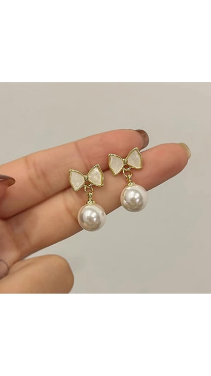 Women's pearl bow earrings