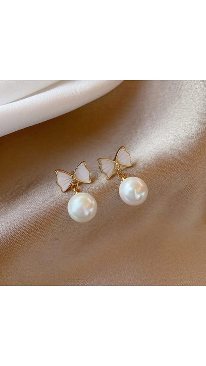 Women's pearl bow earrings